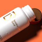 Betakaroten Gold Original bottle close-up on an orange background